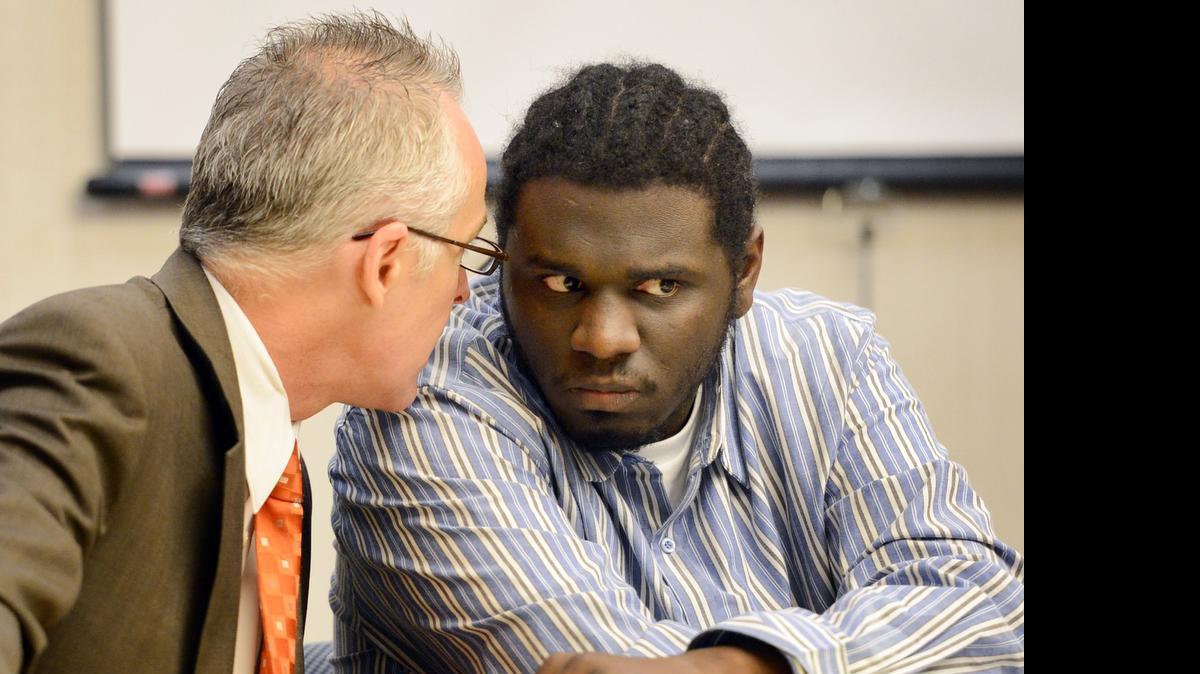
Scott Baly, a Fresno County public defender, consults with his client, Tyrone Cowan, before court opens session in his Fresno County Superior Court case two years ago. Cowan was later convicted of a 2007 murder in southwest Fresno.
