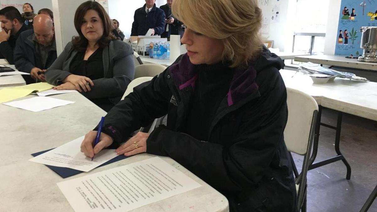 Fresno Mayor Ashley Swearengin signs an emergency proclamation Wednesday that could accelerate repairs at the Summerset Village Apartments near Fresno Street and Clinton Avenue in central Fresno.