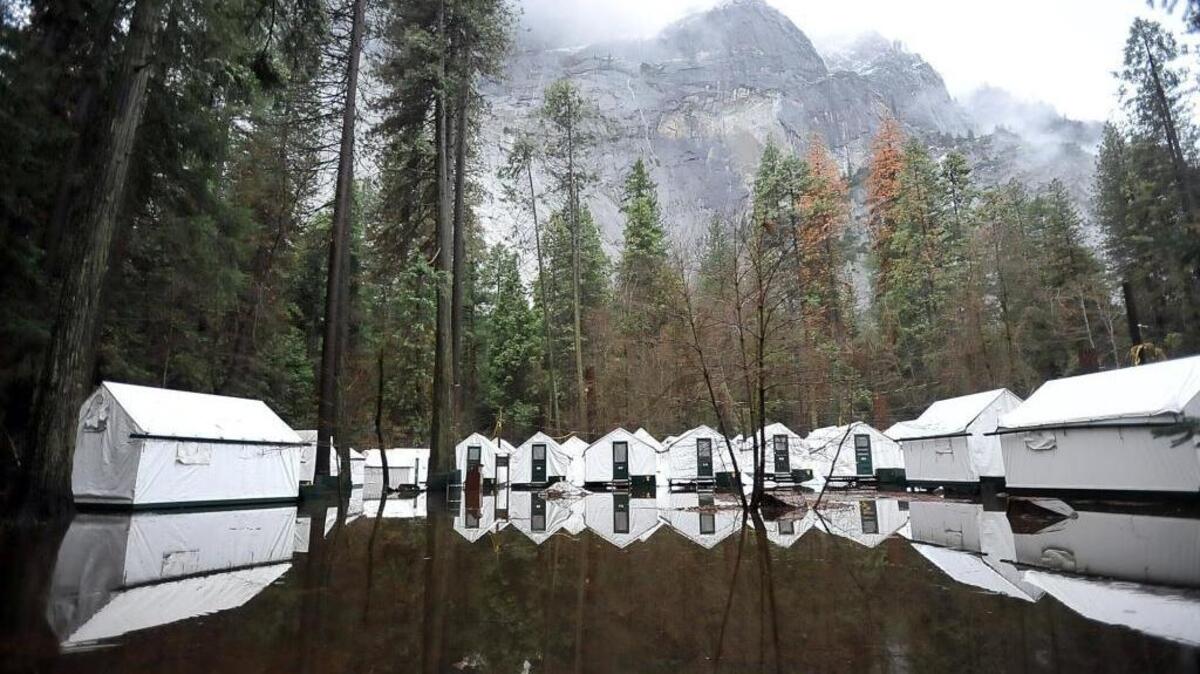 Tent cabins in Half Dome Village sit in flood waters in January at Yosemite National Park. Then, the Merced River crested at 12.7 feet. On Thursday the river rose above flood stage as a result of melting snow. Creasting is due Friday morning.