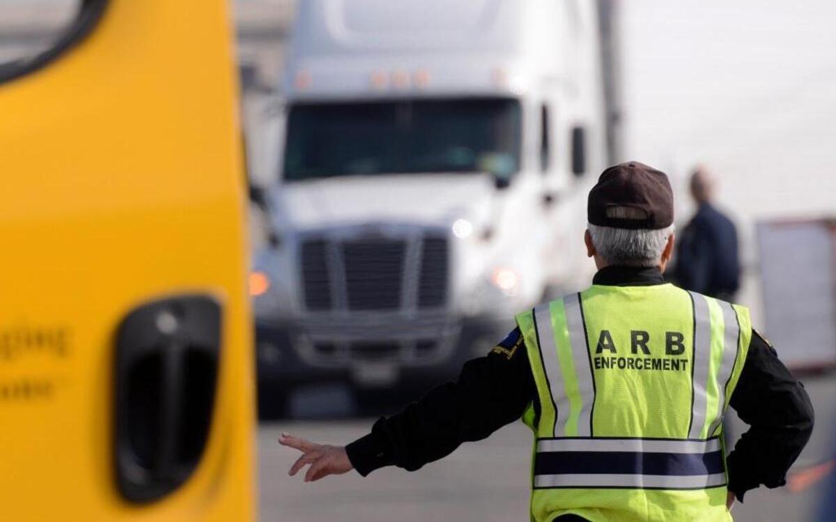 In a 2015 file photo, a California Air Resources Board field supervisor directs a semi truck during inspections on North Avenue, just off Highway 99, to check for compliance with state air pollution laws.