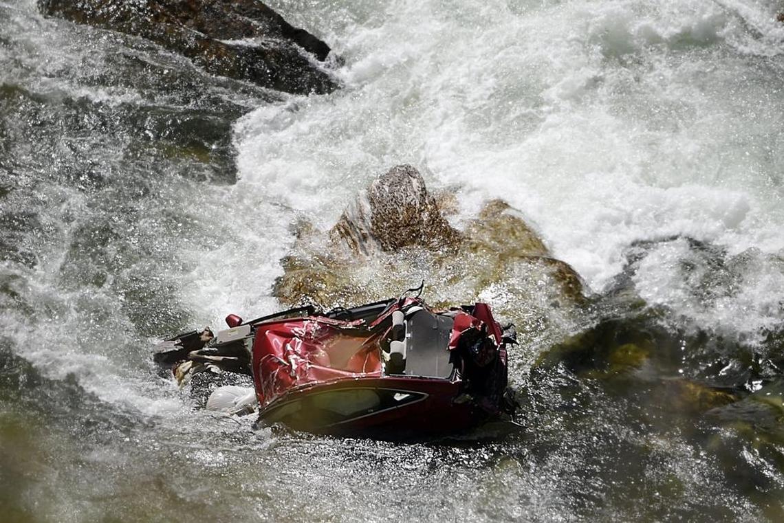 The Kings River roils around the rental car believed to hold the bodies of Thai students Thiwadee Saengsuriyarit, 24, and Bhakapon Chairatanathongporn, 28, near Convict Flat near Kings Canyon National Park.