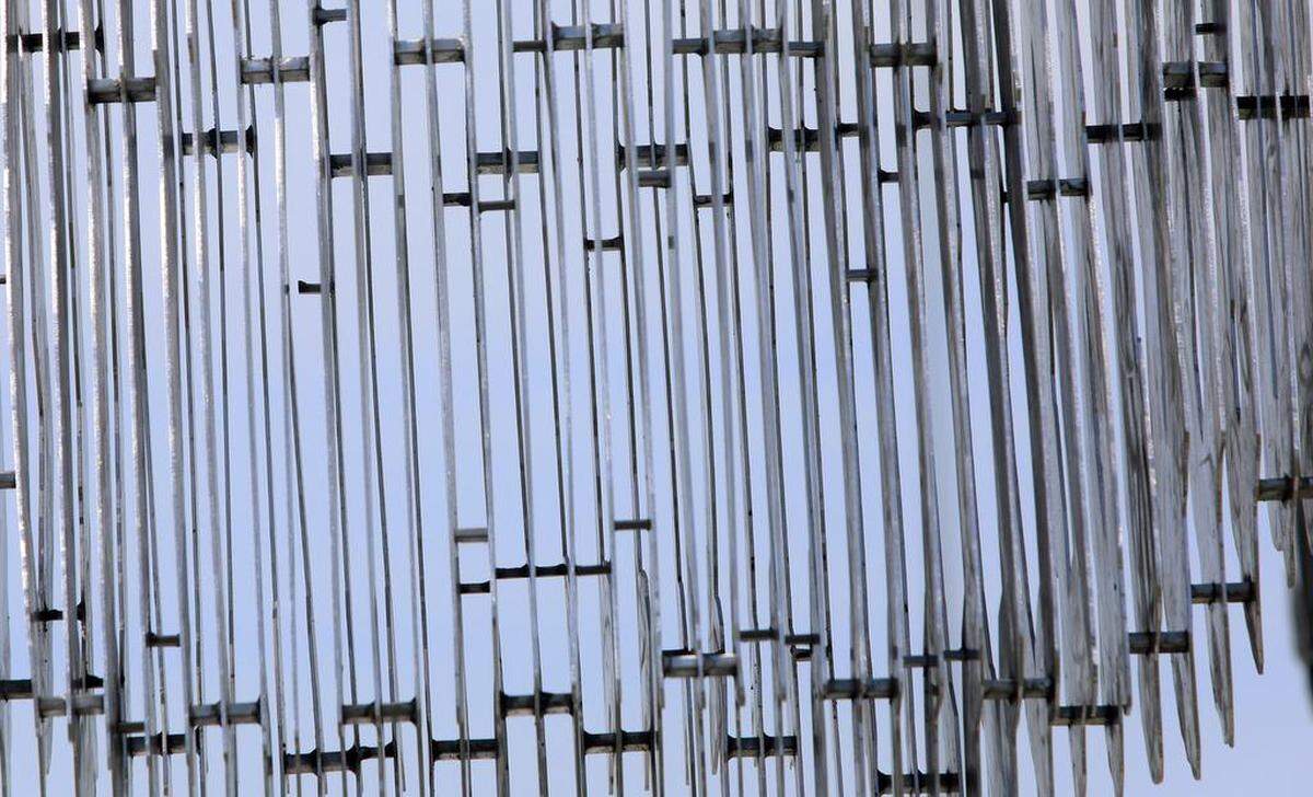 A closeup of a statue that is part of The Five Pillars of Freedom shows the spacing between slabs of metal. The monument was unveiled at Gateway Park in Corcoran on April 29, 2023.