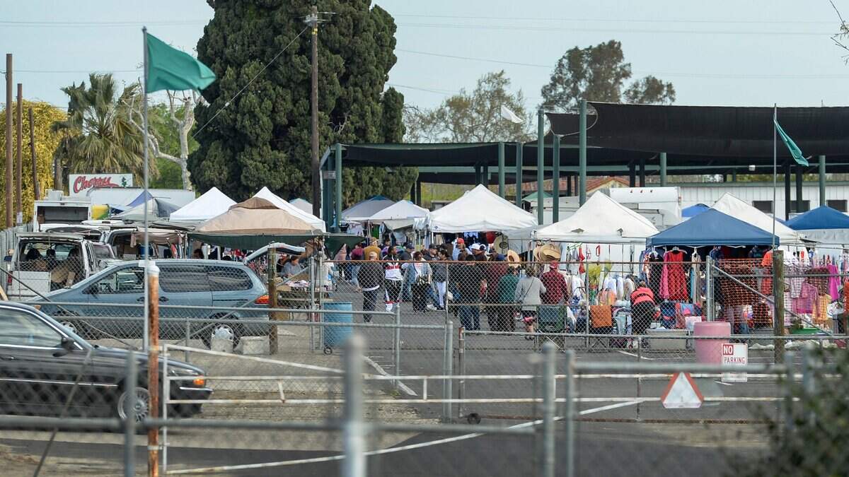 Visitors walk among the vendors at the Cherry Avenue Auction at the corner of South Cherry Avenue at East American Avenue south of Fresno on Tuesday, April 2, 2019. The swap meet and farmers market happens on Tuesdays and Saturdays.