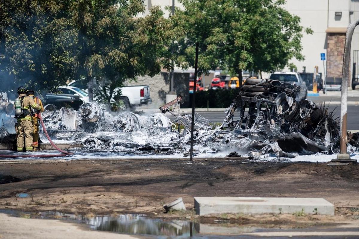 The California Highway Patrol, Atwater Fire Department and the California Department of Forestry and Fire Protection, Merced County, respond to the scene of a tanker truck fire near Applegate Road and Highway 99 in Atwater, Calif., on Tuesday, May, 23, 2017. According to CHP Officer Eric Zuniga, the driver of the tanker truck has been found dead. The cause of the crash and the explosion is still under investigation. According to Mark Lawson, division chief with Calfire-Merced County, the tanker truck was carrying about 9,000 gallons of gasoline.