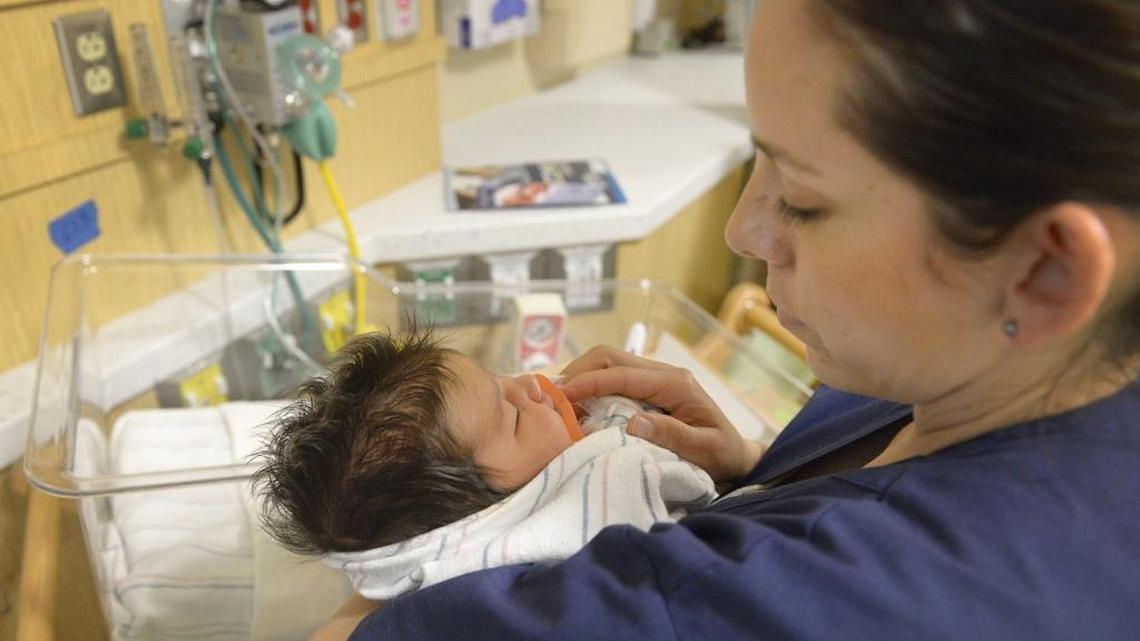 RN Sylvia Aguinaga checks on baby Gabriella in the Valley Children’s Hospital neonatal intensive care unit in Hanford in May 2016. California and the Valley need more ethnically diverse nurses, especially Hispanics.