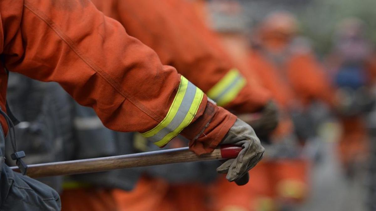 
In an August 2014 file photo, an inmate firefighting crew from Montecito marches up Taylor Mountain to put out spot fires as part of the mop-up after the Junction fire near Oakhurst.

