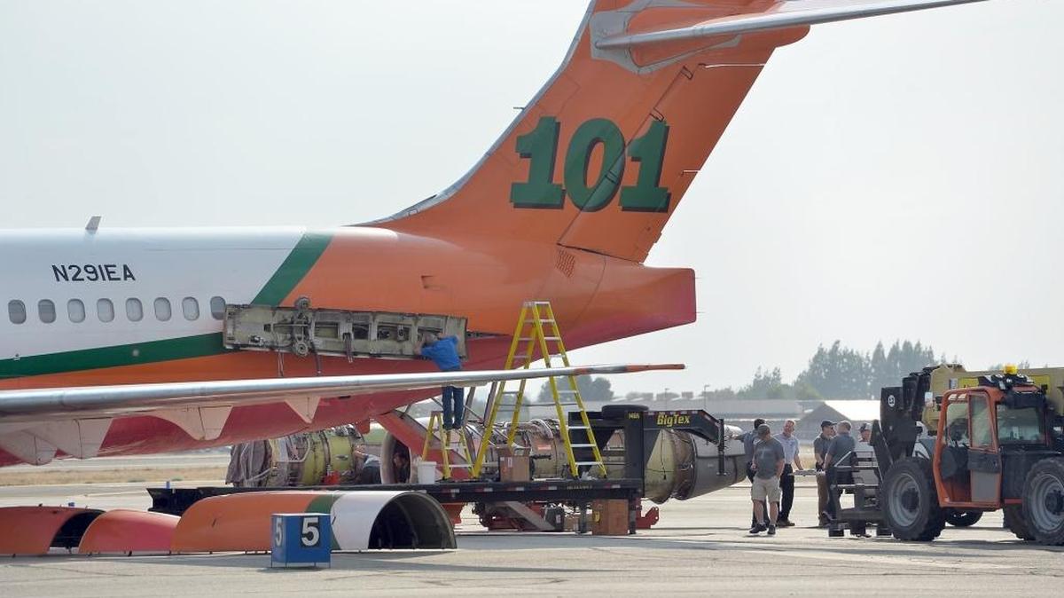 
A DC-9-87 twin-jet air tanker sits on the tarmac with its left engine removed Monday at the U.S. Forest Service’s Air Attack Base at Fresno Yosemite International Airport. The Federal Aviation Administration reported that the airplane’s left engine failed as it took off Sunday afternoon to fight the Rough fire east of Fresno. Debris from the engine apparently fell in a neighborhood northwest of the airport as the plane returned for a successful emergency landing. FAA and Forest Service investigators arrived Monday to look into what caused the engine failure.
