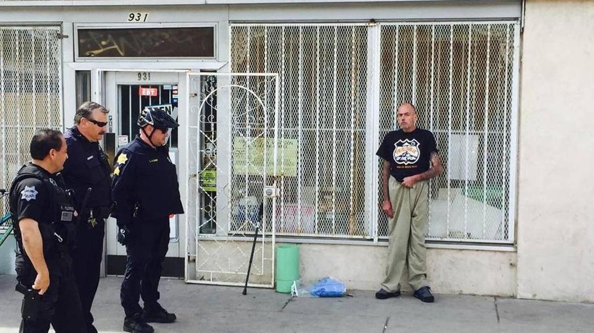 James Kelsey surrounded by police after his most recent bank robbery, March 28, 2016 in Fresno’s Chinatown.