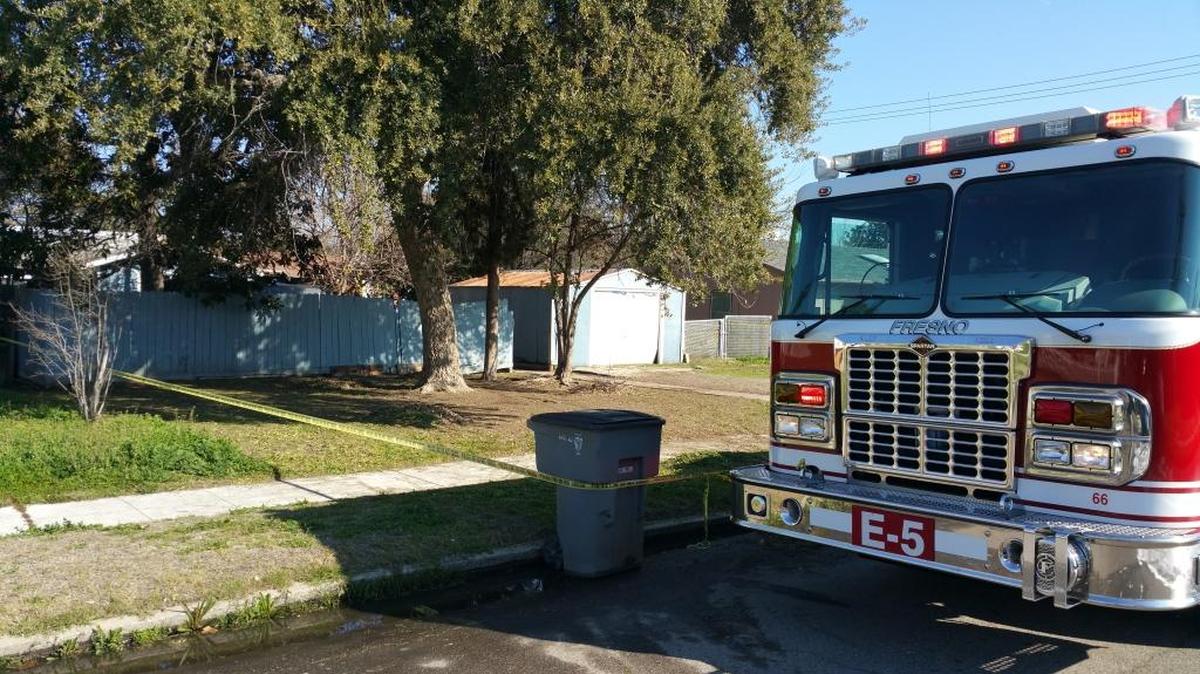 A fire truck is parked in front of a house that caught fire – killing one person – on Cornell Avenue near Shields and Maroa avenues in central Fresno on Saturday, Feb. 6, 2016.