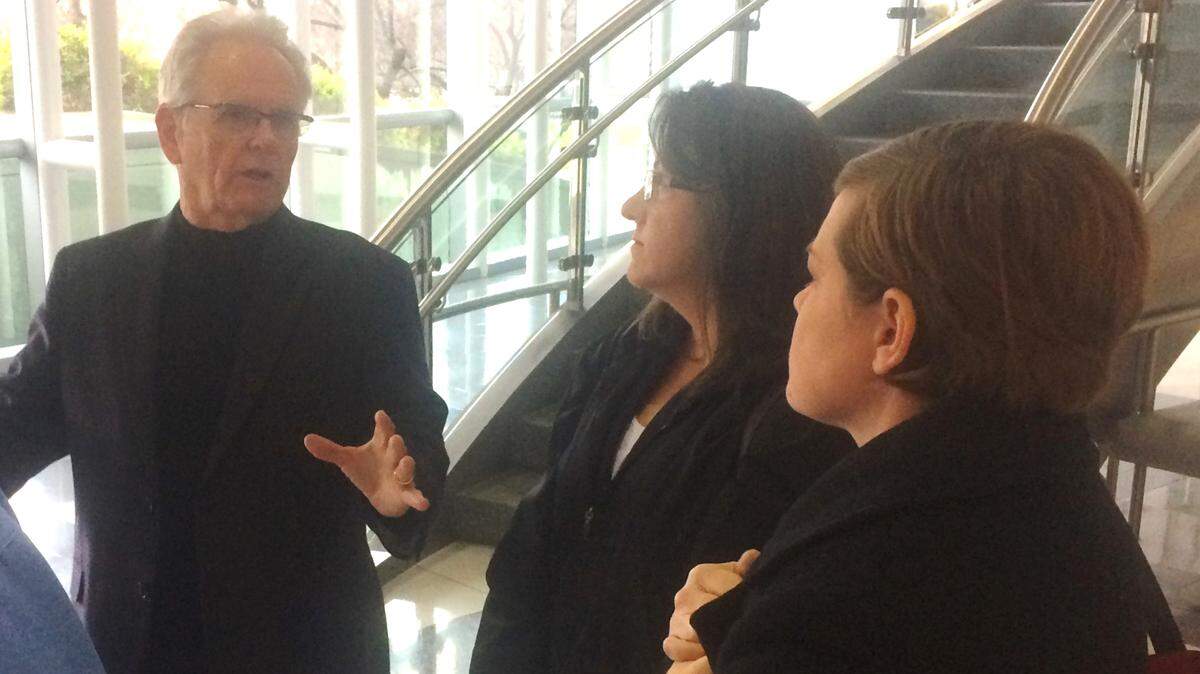 Developer George Beal, left, talks with Lowell neighborhood residents Barbara Fiske and Esther Delahay, right, after the Fresno City Council approved Beal's plans to build a convenience store selling beer and wine at the intersection of Belmont and Van Ness avenues in central Fresno.