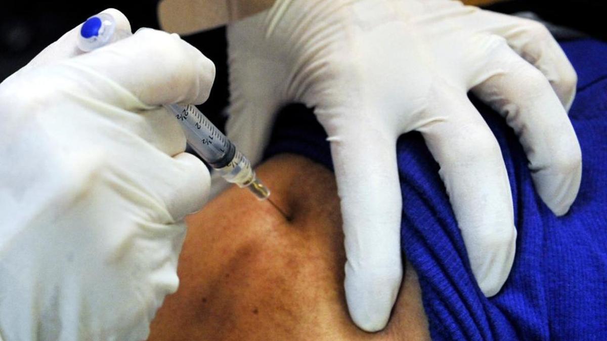 In a 2014 file photo, a flu shot is seen being given at Fresno County Department of Health’s immunization clinic on Fulton Mall.