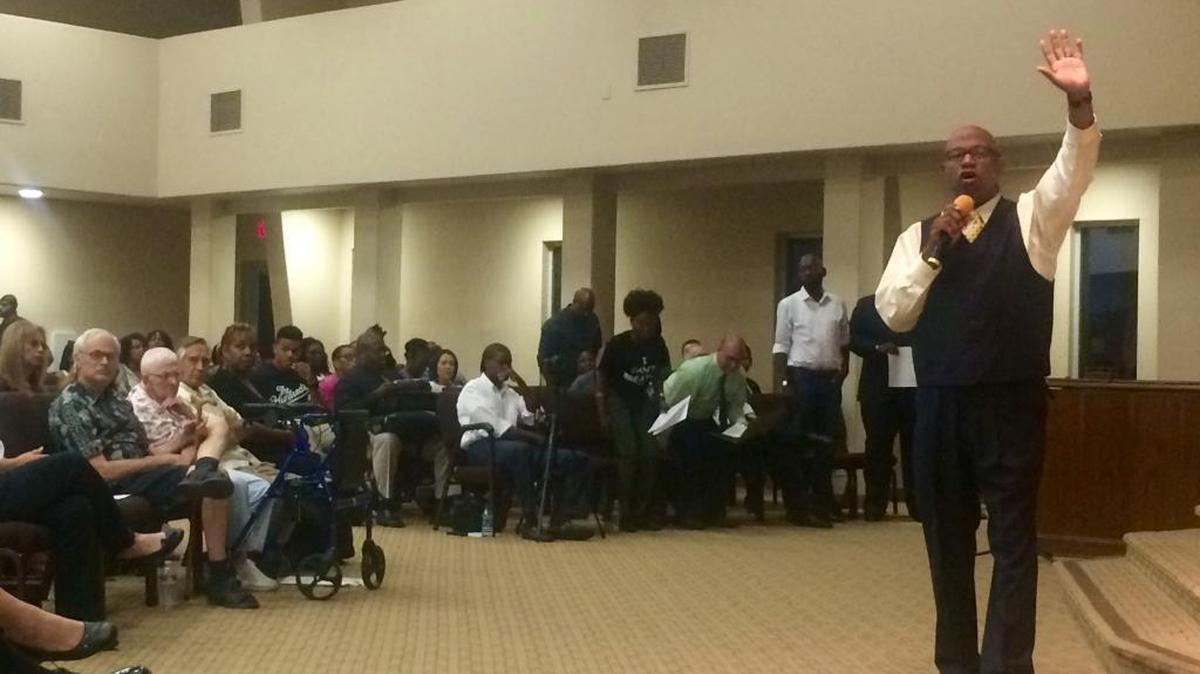 
Around 250 community members attended a town hall on race issues and policing Tuesday night at Westside Church of God in southwest Fresno. The Rev. Booker T. Lewis II of Rising Star Baptist Church raises his hand asking people in the audience to commit to participate in a future forum. 
