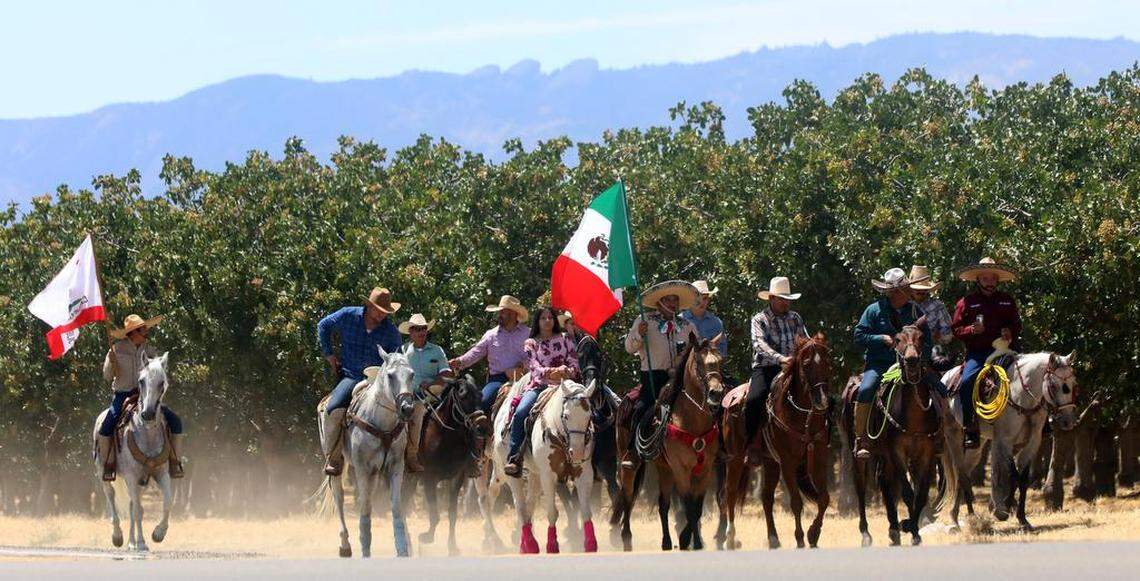A group of riders make their way north to Three Rocks during the 45th annual Joaquín Murrieta Horse Pilgrimage on July 30, 2023. In the background are the Three Rocks on the Mountain Range.