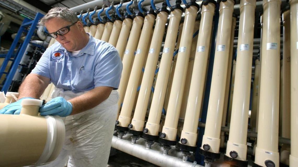Clovis public utilities worker Cohen Van Noy prepares a new water membrane filter before installing it at the city’s Surface Water Treatment Plant in 2010.