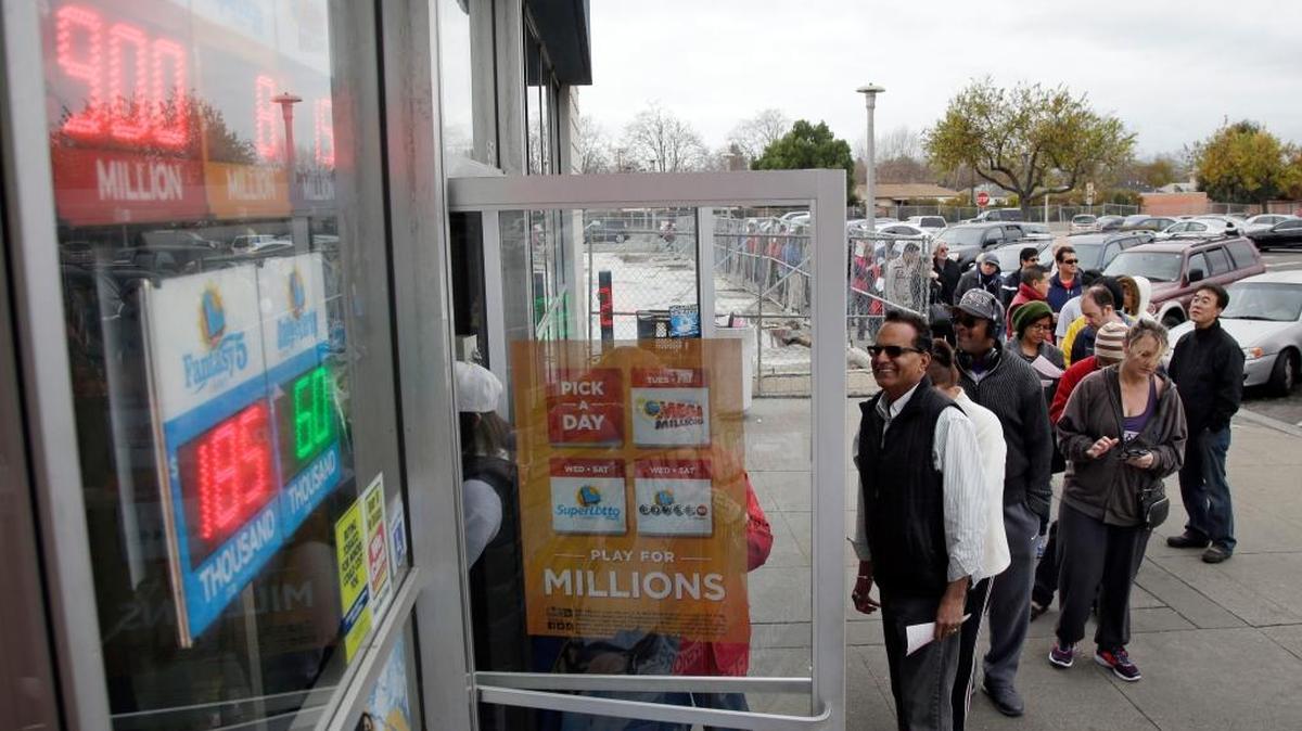 People line up to buy Powerball tickets at Kavanagh Liquors Saturday, Jan. 9, 2016, in San Lorenzo, Calif. Ticket sales for the multi-state Powerball lottery soared Saturday in the largest jackpot in U.S. history which grew to $900 million just hours before Saturday night's drawing.