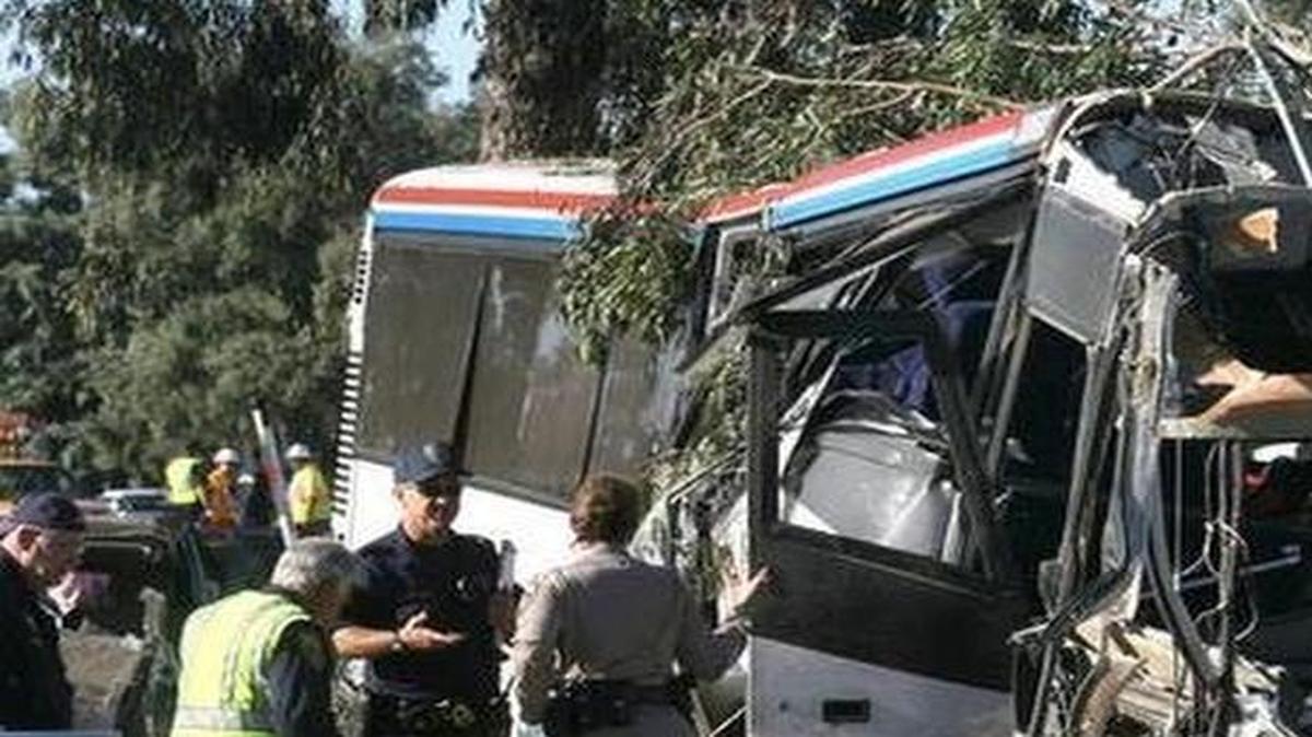 
Investigators and law enforcement are seen the scene of a crash July 22, 2010, that involved a Greyhound bus and an SUV. Six people died.
