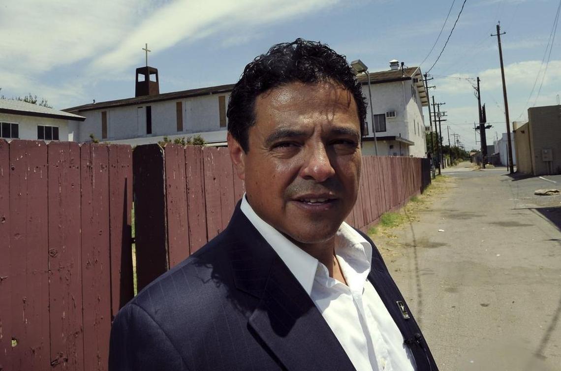 Pastor Elias Loera of Christian Temple walks the alley behind the southeast Fresno church where he says he often finds the homeless or evidence of homeless living and trash.