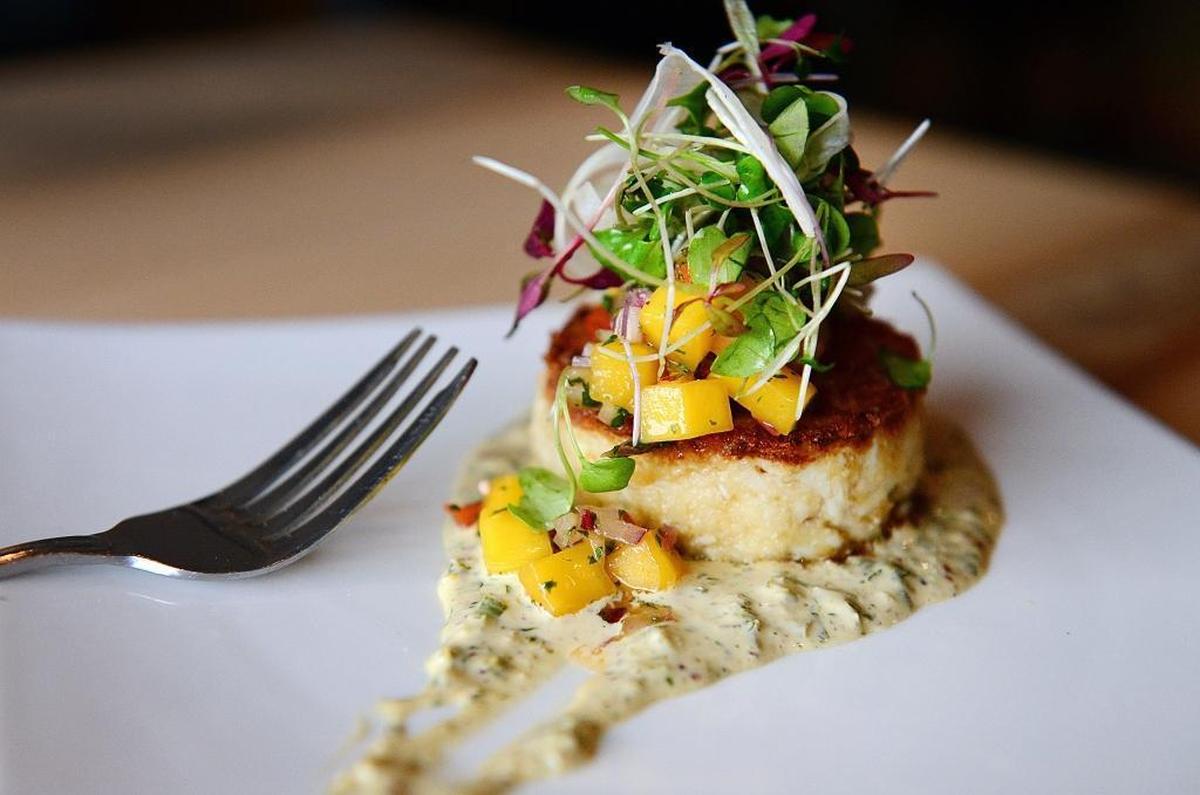 The 3-ounce blue crab cake with jalapeño remoulade and mango salsa is pictured in this Fresno Bee file photo from Trelio in Clovis.