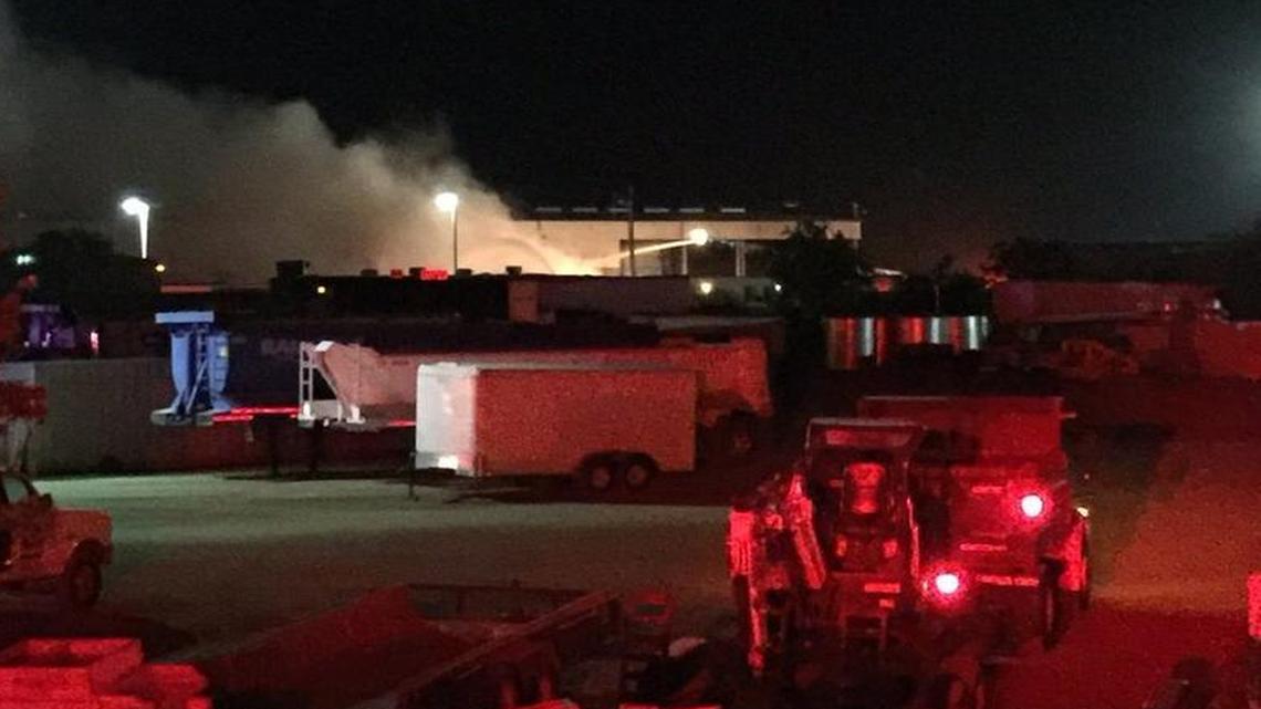 Firefighters battle a burning pile of debris at a recycling center south of Fresno on Tuesday, July 12, 2016.
