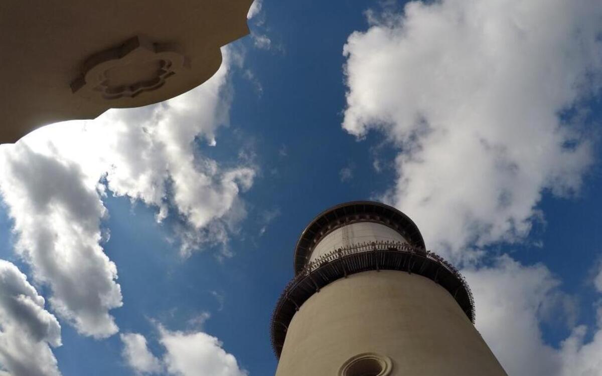Puffy clouds pass over the Fresno Water Tower Monday afternoon. Fog will cloud the sky through Thursday, then rain is expected for the weekend.