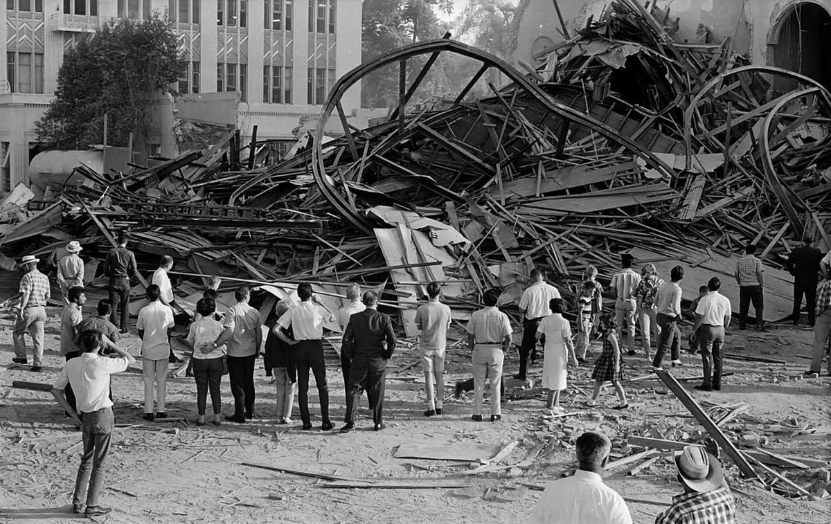 Carl Crawford captured a poignant (and previously unpublished) scene in his last frame from the 1966 Fresno County Courthouse demolition: A small group of onlookers look over the mangled pile that once was the dome of the historic building.