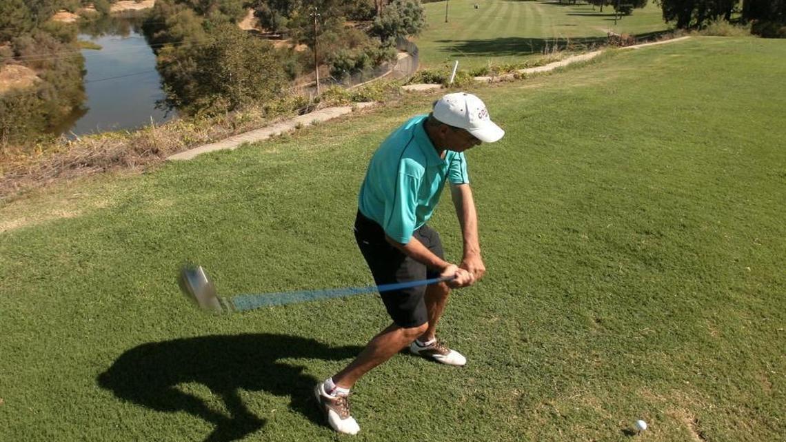 Randy Craven, a Riverside Golf Course golfer for 30 years, drives his ball down the 10th fairway, a favorite with regulars with its scenic view of the San Joaquin River.
