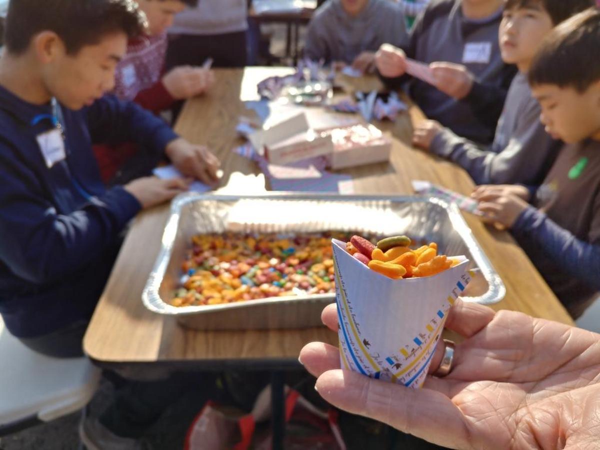 An origami cup holds a snack mix prepared by women from the United Japanese Christian Church in Clovis during the Fresno Interdenominational Refugee Ministries’ 23rd annual Christmas Party on Dec. 16, 2017.