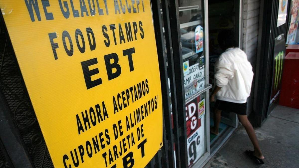 A woman heads into a store along Elm Avenue in west Fresno.