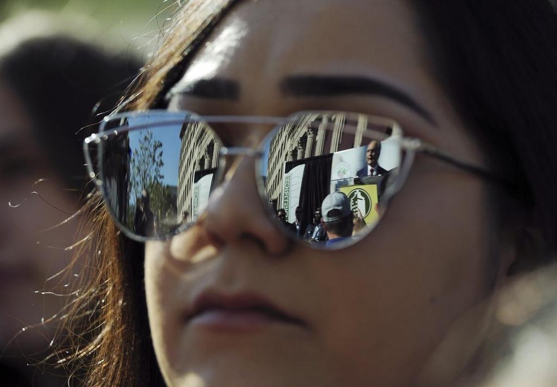 Fresno Mayor Lee Brand is reflected during ceremonies to celebrate the reopening of Fulton Street to vehicle traffic Saturday, Oct. 21, 2017.