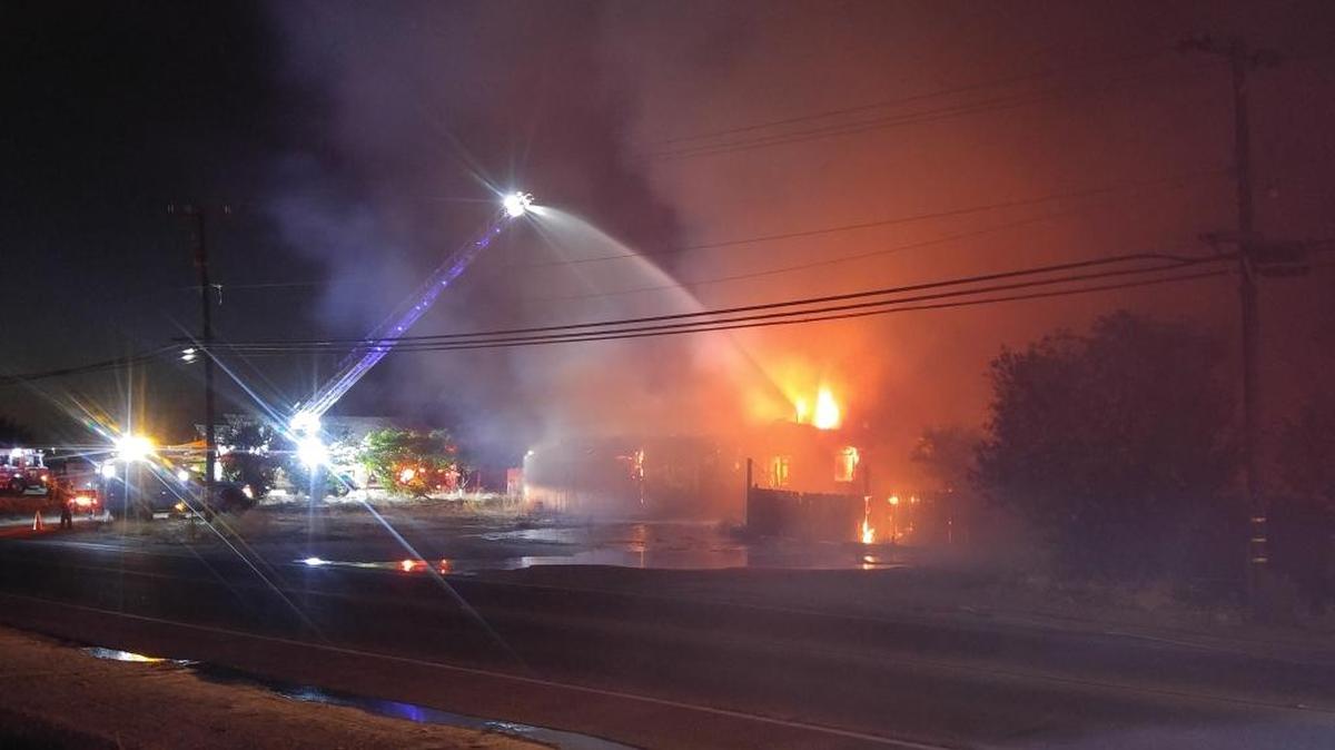 Firefighters are battling a fire that began in a vacant building on Shaw Avenue in northwest Fresno on Friday night.