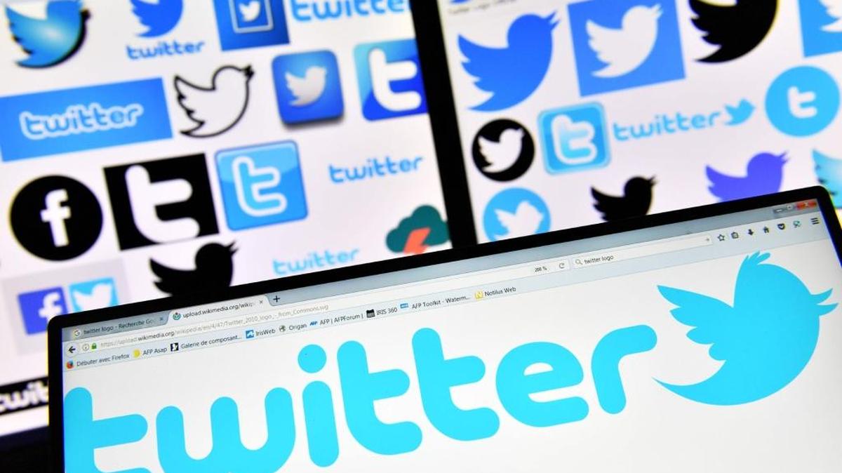 This file photo taken on Nov. 20, 2017 shows logos of US online news and social networking service Twitter displayed on computers’ screens. Twitter said it began enforcing new rules on Dec.18 aimed at filtering out “hateful” and “abusive” content on the social network including messages which promote or glorify violence. The platform has long faced criticism over how it deals with hate groups and content, which led it to removing verification badges from prominent U.S. white nationalists last month.