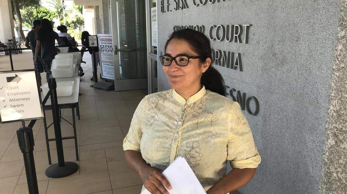 Delia Montana, 47, of Fresno, stands outside the B.F. Sisk Courthouse in downtown Fresno in June 2018 after filing a lawsuit against the city of San Joaquin. A Fresno judge on Oct. 25 denied Montana’s motion for a new trial in the case.