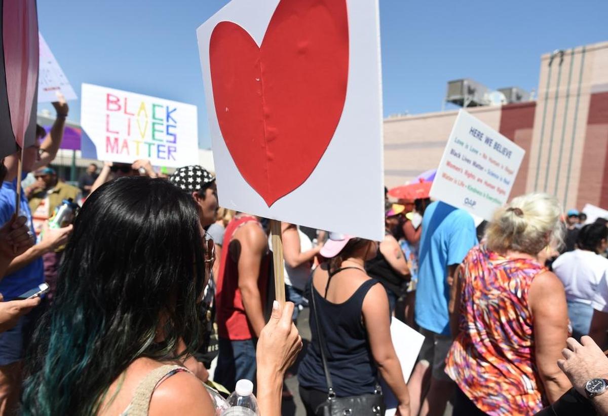 A protester and her heartfelt message of love during the “Fresno’s Counter Rally Against Hate,” in the Tower District Saturday morning, Aug. 26, 2017.