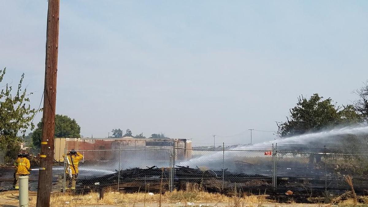 A fire crew extinguishes the flames on house that was under construction near Cedar and Dwight avenues on Monday, Sept. 4, 2017 in Fresno, California