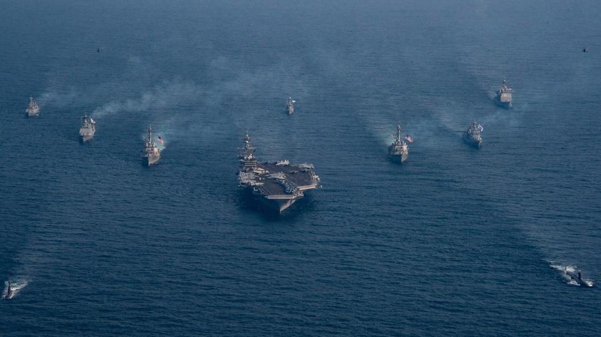 The USS Carl Vinson, as shown in an aerial photo by the Navy of the strike group, has several hundred people from Lemoore on board the aircraft carrier.