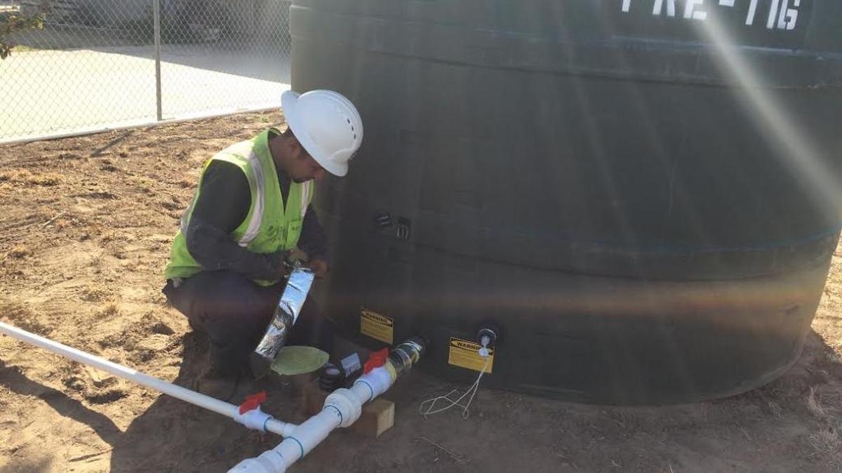 Self-Help Enterprises has taken on hundreds of drought-related projects, including this one in Daleville, south of Fresno, where a water tank was installed at a home without water.