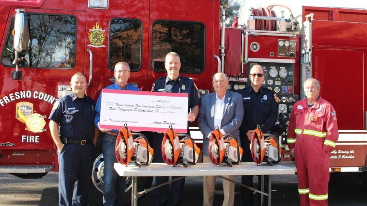 Cal Fire personnel show off four rescue saws donated by Aera Energy LLC.