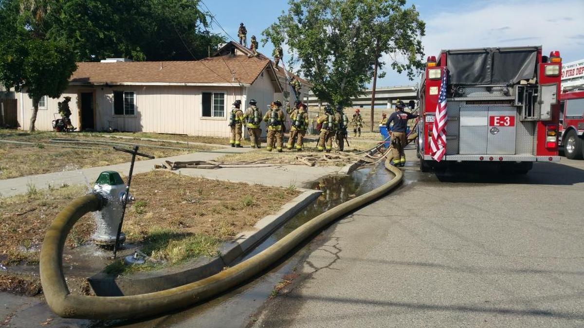 Fresno firefighters work to put out a two-alarm fire in downtown Fresno on Sunday, May 29.