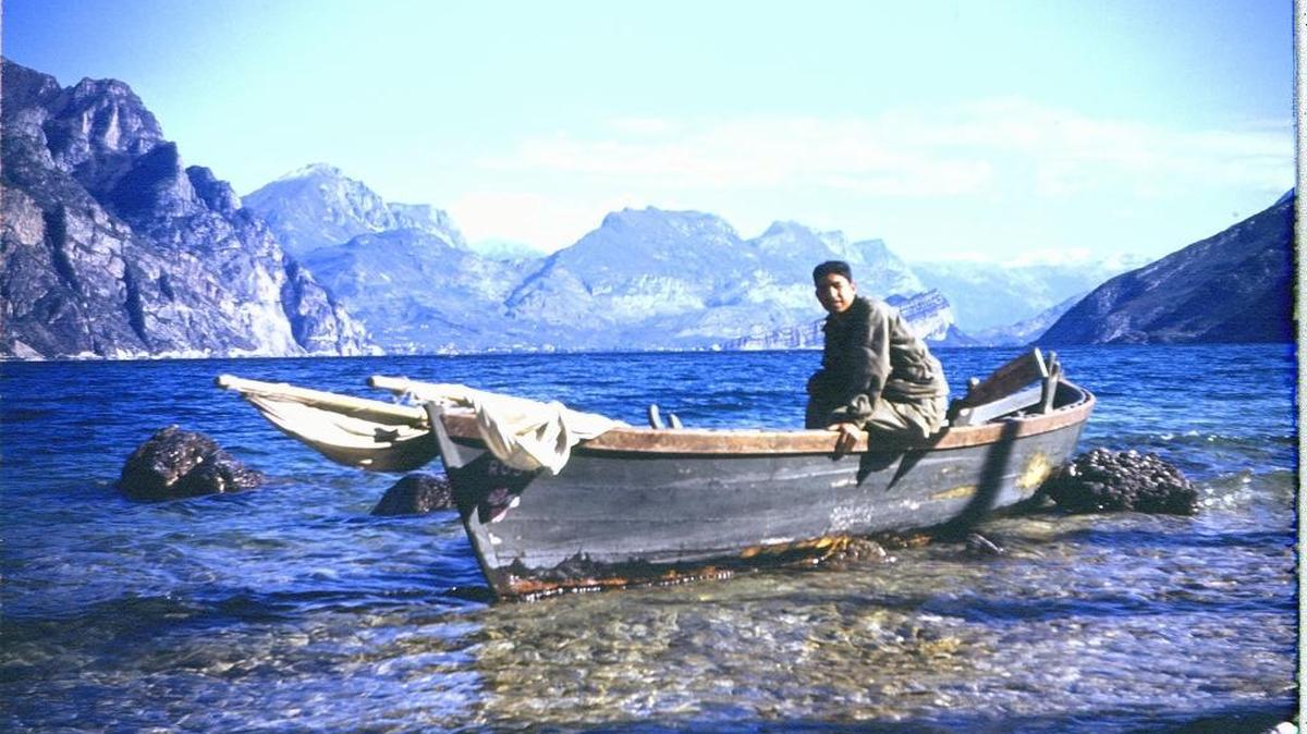 Cruz Rios in a boat along the shore of Lake Garda. April 1945.