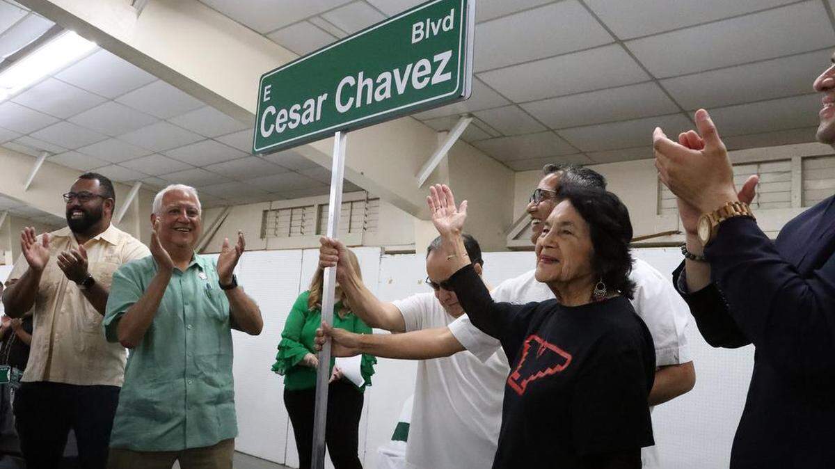 Paul Chávez and Dolores Huerta unveil the Cesar E. Chavez Boulevard sign during the celebration of the renaming of Kings Canyon and two other streets in honor of farmworker icon César E. Chávez. The celebration took place at the Fresno fairgrounds on June 10, 2023.