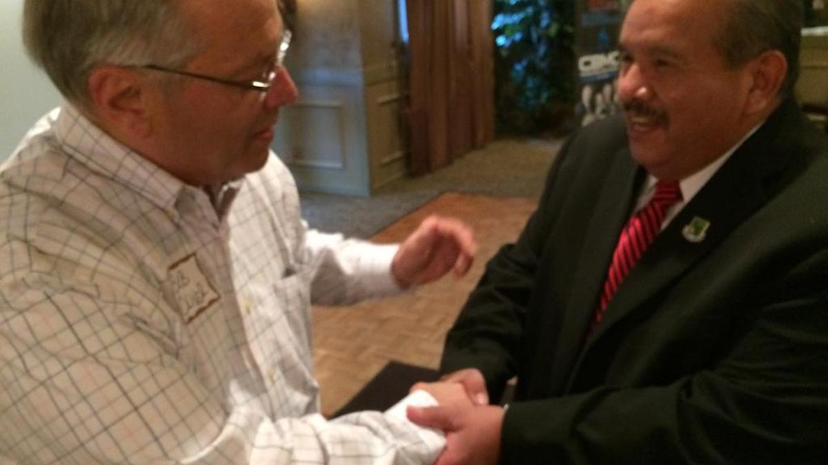 Robert Oliver, left, a retired Fresno County Superior Court judge, shares a laugh with Rev. Larry Arce, who announced Tuesday that he has retired as CEO of the Fresno Rescue Mission. Oliver and Arce used to work together when Arce was a probation officer before he took over the mission in 1998.