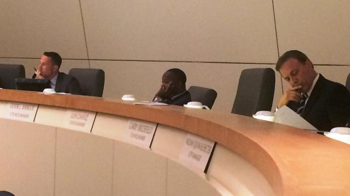 Fresno City Council members Clint Olivier, left, Oliver Baines and Garry Bredefeld, right, listen to public testimony before voting on a law to prohibit recreational marijuana dispensaries and other commercial cannabis operations in the city on Thursday, Aug. 31.
