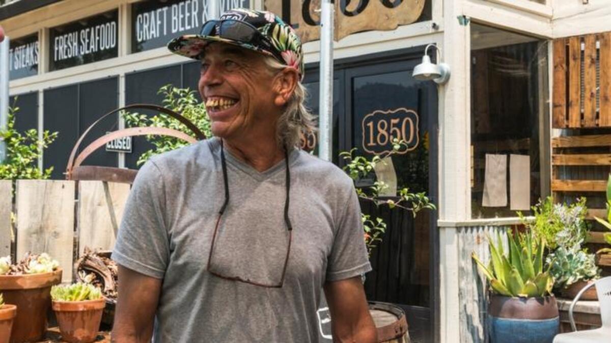 Greg Wackerman, whose son owns the 1850 Restaurant in Mariposa, lights up when told evacuation orders had been fully lifted on the town Friday. “I love that, I love that. It’s great for the townspeople,” he said.