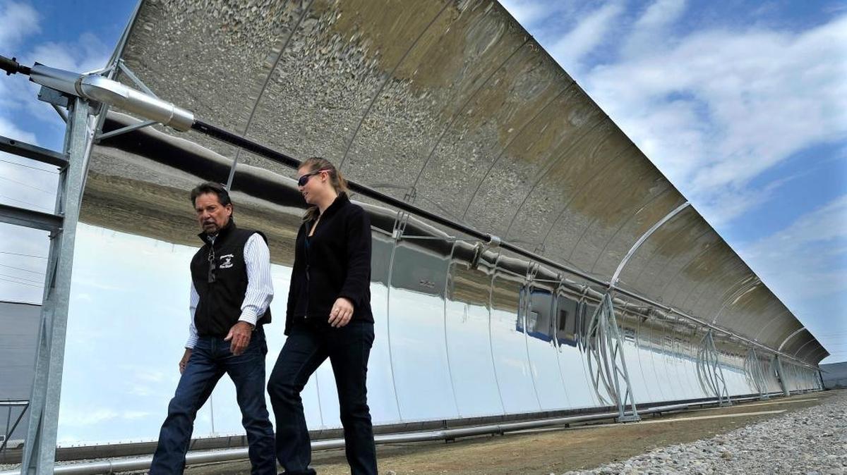 In this file photo, Dennis Falaschi, general manager for the Panoche Water and Drainage District and Casey Arthur, civil engineer with U.S. Bureau of Reclamation, walk past the 377-foot-long WaterFX SkyTrough, which is used to desalinate drainage water, at the plant near Firebaugh. The district recently discovered some old barrels full of a chemical substance on different property it owns and is now working on a cleanup.