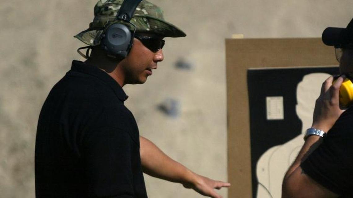 Derik Kumagai, left, seen in this 2008 file photo, was one of the Fresno police officers who seized money from two businessmen during a 2013 gambling investigation. The businessmen alleged in federal court that police stole thousands of dollars and rare coins seized in the investigation. Kumagai later pleaded guilty to bribery in an unrelated case.