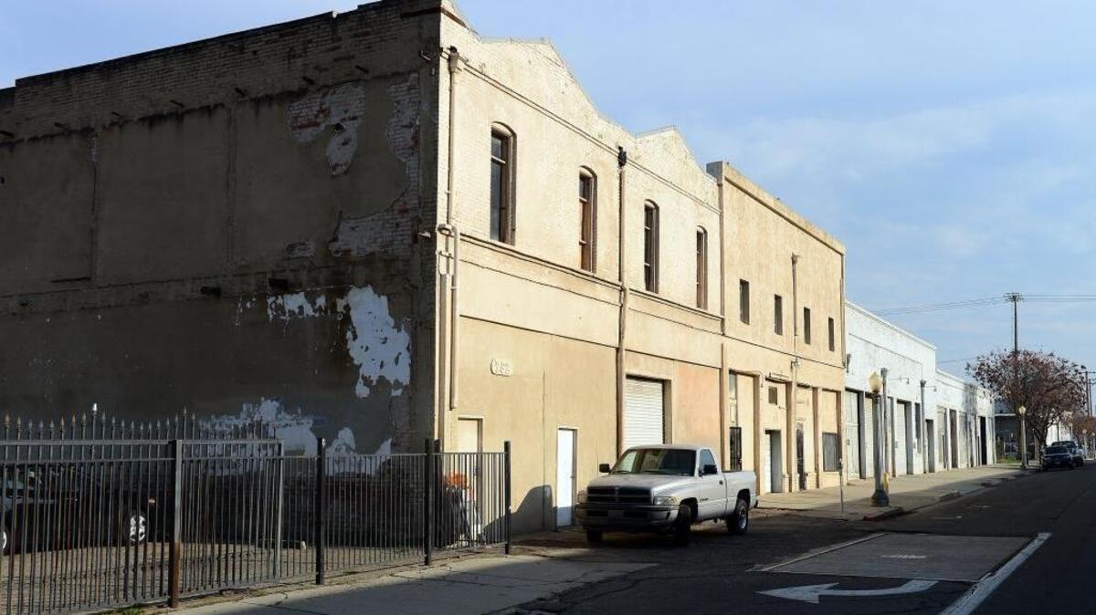 Developer Terance Frazier owns this block of warehouses on the east side of H Street near Chukchansi Park in downtown Fresno. He has plans to tear down and renovate the buildings into apartments, restaurants and entertainment.