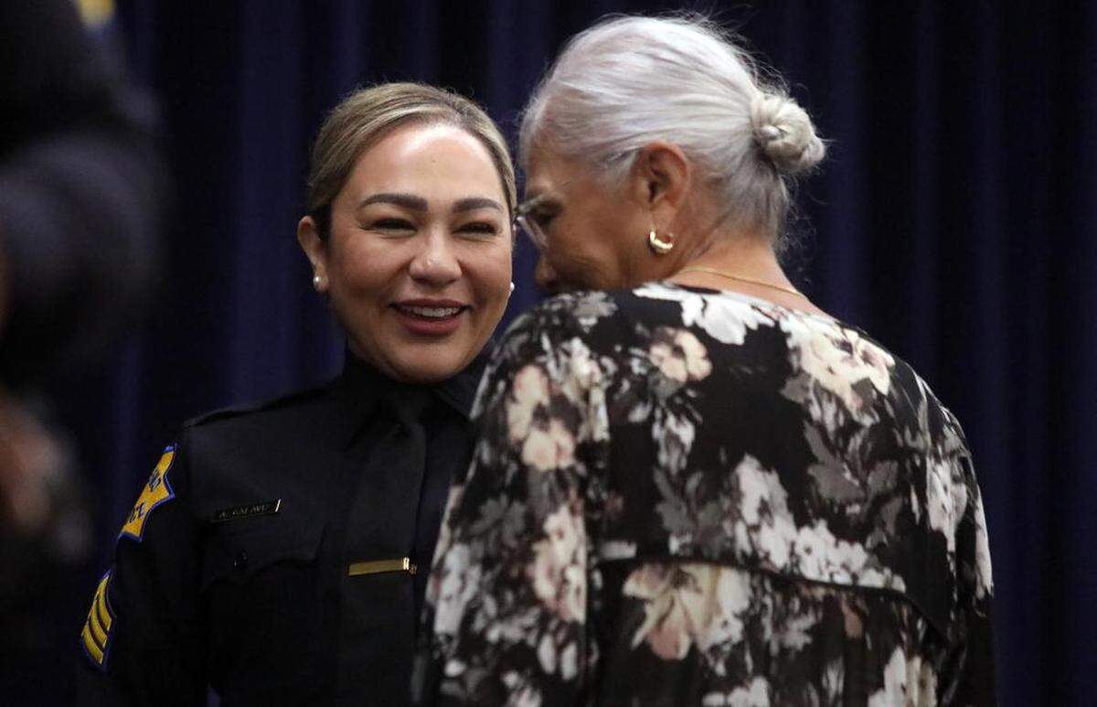 New Fresno Police Sgt. Amada Galaviz smiles at her mother, Rosemary Galaviz, after being sworn in at Sept. 1, 2023 ceremony at the Fresno Convention Center.