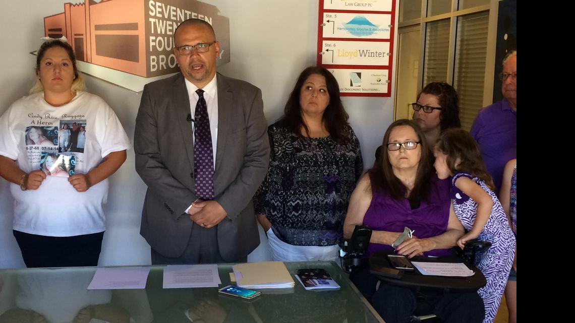 
Kevin Little speaks at a news conference about a federal lawsuit he filed on behalf of two domestic violence victims. At his left is a wheelchair-bound Pamela Motley, who was shot by her estranged husband, whoturned the gun on himself. To Little’s right is Yvette Caldera, the daughter of Cindy Raygoza, who was stabbed to death by her former boyfriend, who was then shot by police. She holds a picture of her mother.
