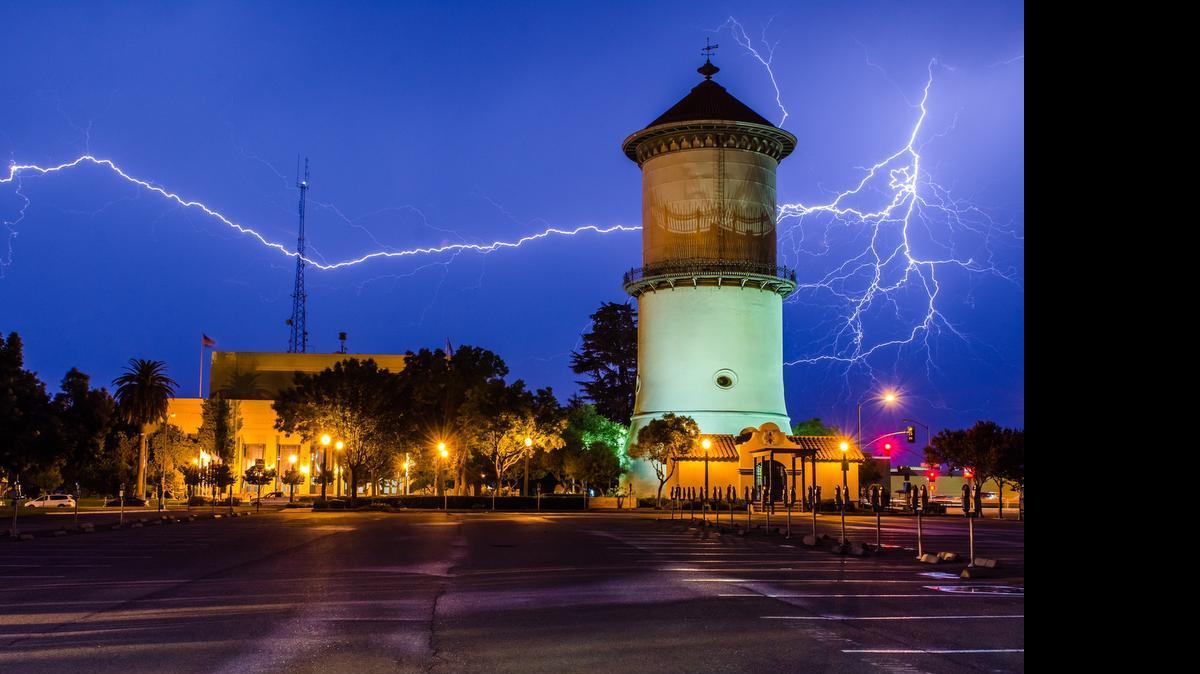 
Amateur photographer Randy Reed made this image during the storm Saturday night, July 18, 2015 at the downtown Fresno water tower. Reed says the lightning hit near the end of an approximately 5-second exposure.

