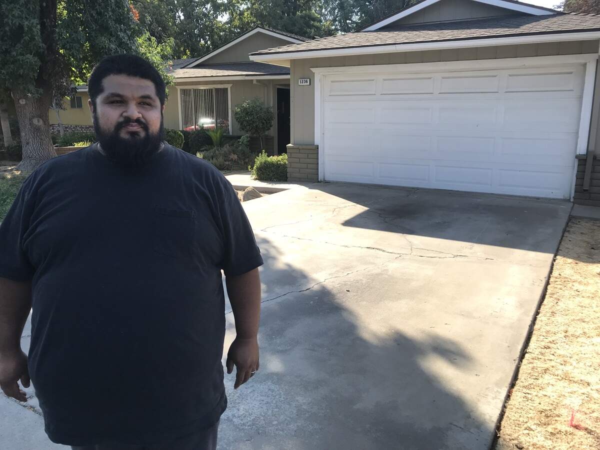On Wednesday, Aug. 18, 2018, Sammy Franco visits his old Clovis neighborhood near Barstow and Willow avenues. He and his wife, Rachel, and their two children had lived in the home, pictured here, since 2007 before losing it this year due to a foreclosure. The Francos, former owners of the Beach Hut Deli at Fresno State’s Campus Pointe, blame their longtime friend, Fresno developer Terance Frazier, for their financial troubles.
